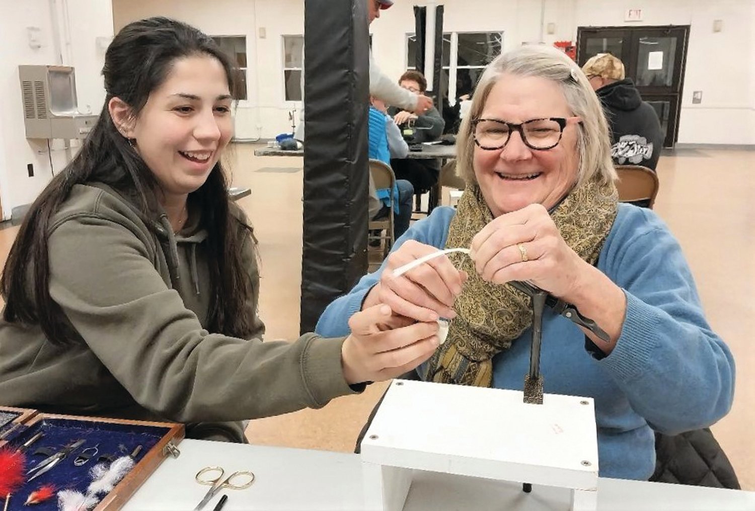 WORKSHOP: Cora Flowers, Coventry and Melisa Sullivan, Wakefield share a fun moment at DEM’s fly tying program offered Monday evenings. Visit https://dem.ri.gov/events/fall-fly-tying-workshop. (Submitted photos)